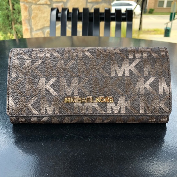 Michael Kors Handbags - Michael Kors Jet Set Travel Carryall Wallet Brown